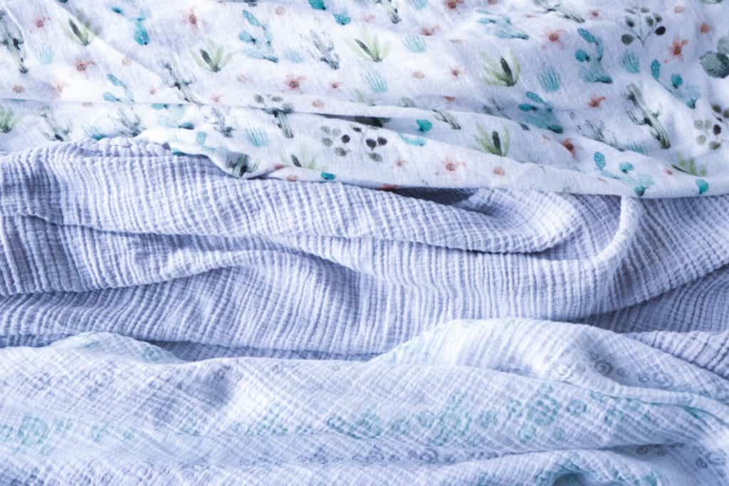 muslin swaddles a must have for new parents when caring for a newborn 